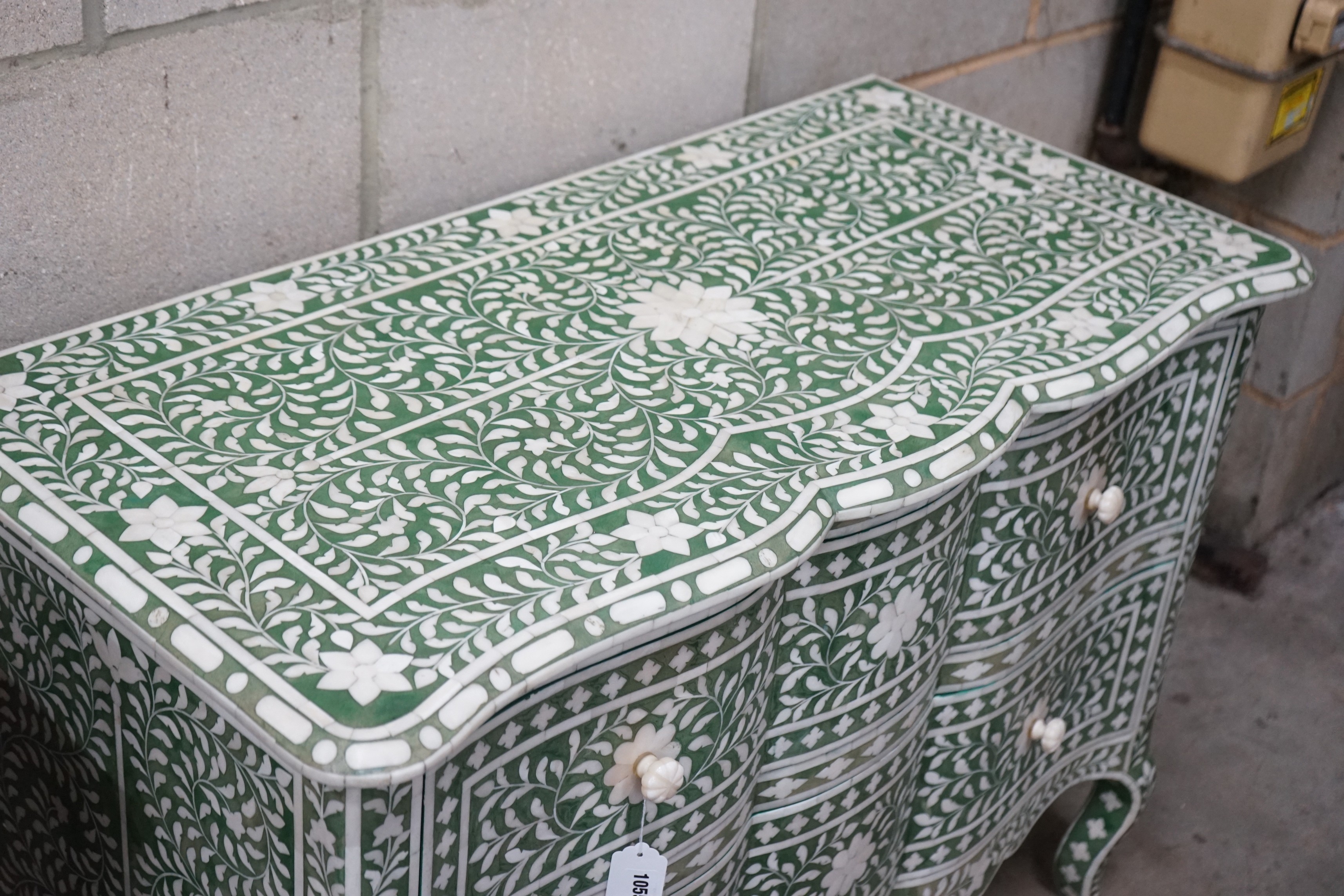 A contemporary green stained bone two drawer commode width 106cms, depth 50cms, height 76cms.